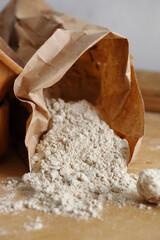Almond flour pile top view isolated on brown background