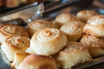 Breakfast table with a lot of food and focus on the first item