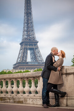 Romantic couple in Paris kissing, Eiffel Tower in the background