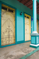 Doors and windows of colorful colonial houses, Baracoa, Guantanamo province, Cuba.