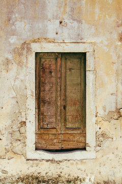 old wooden door on abandoned stone wall