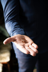 Accessories for men for wedding, groom in costume, belt, bow tie, wedding rings, bouquet and watches