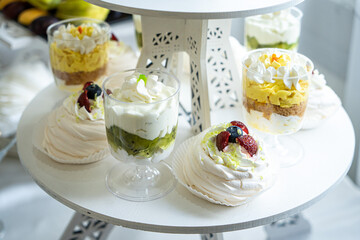 Wedding sweets, decorated tables, decorations and cupcakes, delicious meat and delicacies