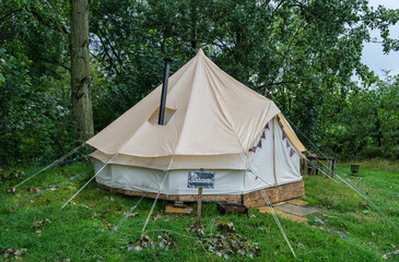 A fabric bell tent in the woods