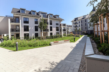 Modern apartment buildings in a green residential area in the city - 375184472