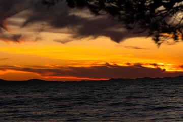 Colorful sunset at the Adriatic sea photographed in August 2020 in Zadar, Croatia