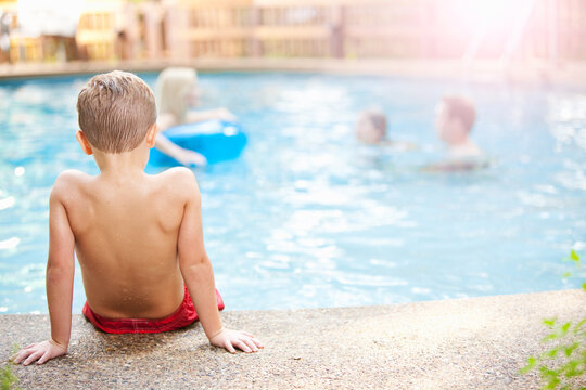Swimming: Boy Sits By Pool For Time-Out or Rest