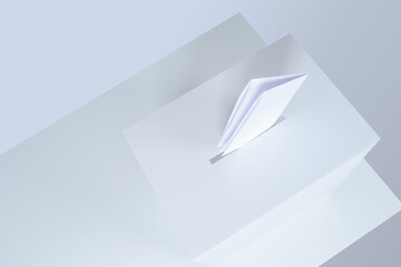 The ballot and the ballot box. A white voting box isolated on a white background. View of the...