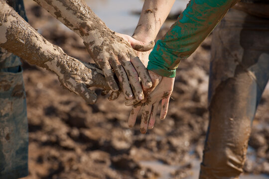 Muddy Hands in Huddle