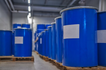 Chemical industry, paint and varnish production . Metal barrels for chemicals. Barrels are stored in a warehouse.