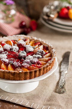 fruit tart with apricots cherries and strawberries