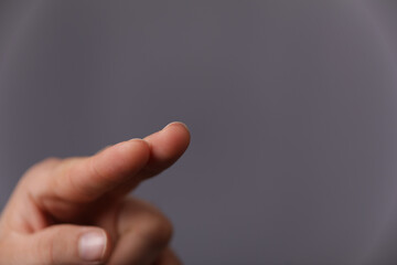 A man hand touching virtual screen, modern background concept , can put your text at the finger, copy space.