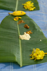 Traditional Kerala food laid out on a banana leaf during the Onam festival in Kerala India 