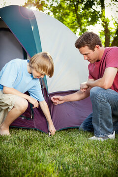 Camping: Working Together To Set Up Tent