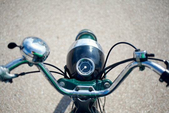 Steering wheel of an old timer motorbike.