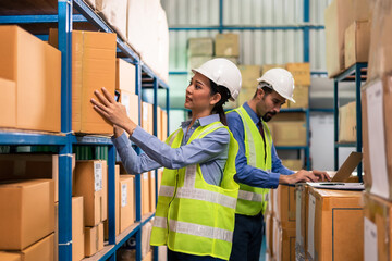 Two warehouse worker working together warehouse management