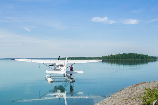Man Standing on the Float of a Seaplane