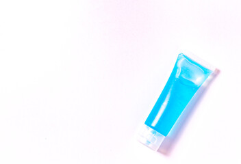 Flat lay blue alcohol gel tubes for prevention and disinfection of corona virus. Or hand wash in hospital or home for safety. Isolated style with white background and copy space for text.