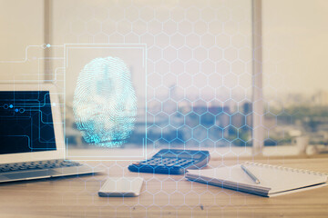 Computer on desktop in office with finger print drawing. Double exposure. Concept of business data security.