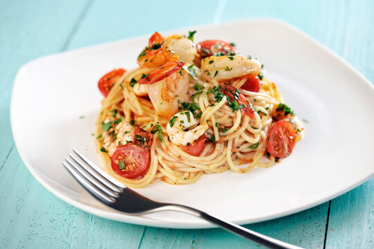 Delicious pasta with gambas and tomatoes