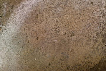 Old grungy and dirty beige concrete wall for background