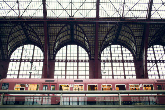 Train Waiting On A Platform Of An Old Railway Station.