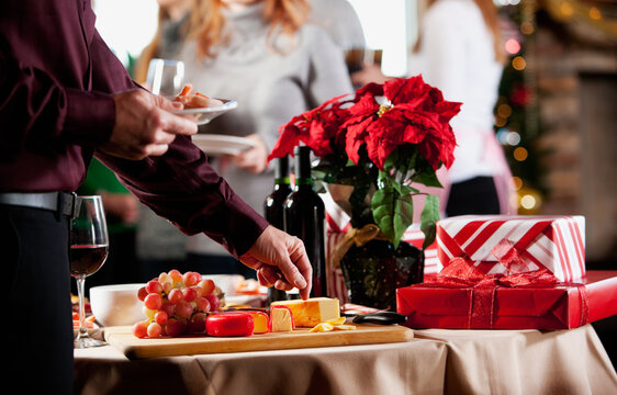 Christmas: Man At Party Getting Food