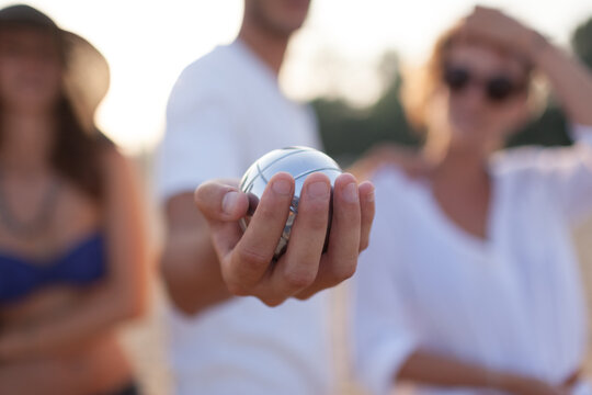 Man Holding a Bocce Ball During the Game . Close up