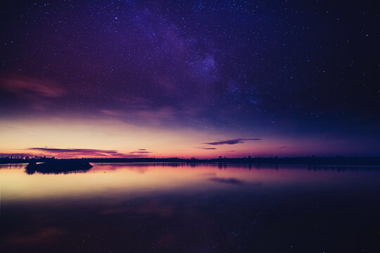 Lake at sunset, the first stars begin to appear