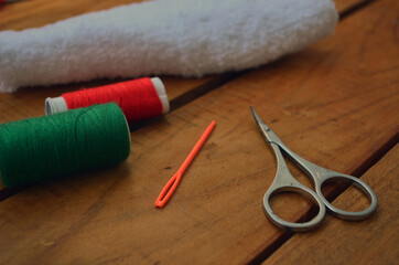 Fototapeta na wymiar Threads, scissors, knitting needles, hook. Everything for handmade.