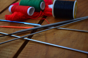 Threads, scissors, knitting needles, hook. Everything for handmade.