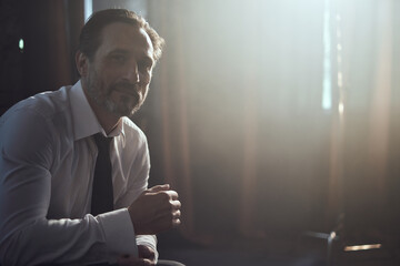 cinematic photo shoot of the confident actor celebrity look in foggy loft room