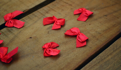 Red bows for knitted toys. Needlework.