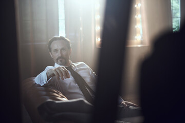 cinematic photo shoot of the confident actor celebrity look in foggy loft room