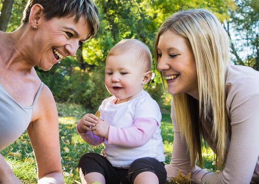 Playful three-generation family at a park