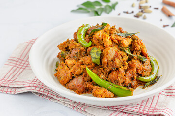 Indian Style Spicy Stir-Fried Chicken with Curry Leaves and Green Chilies