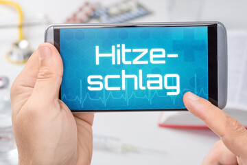 Smartphone mit dem Text Hitzeschlag auf dem Display