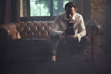 cinematic photo shoot of the confident actor celebrity look in foggy loft room