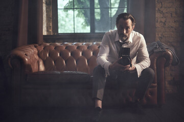 cinematic photo shoot of the confident actor celebrity look in foggy loft room