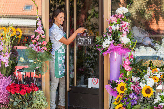 Florist opening her flower shop.