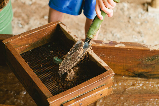 child mining for gemstones