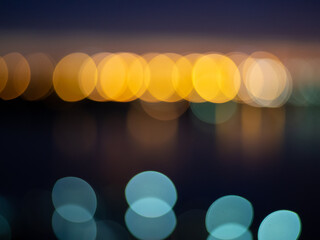 Color Bokeh against a dark background for use at graphic design, yellow and blue circle