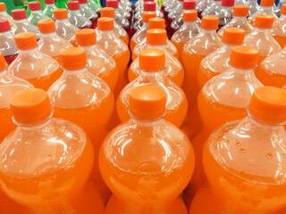 Soft drinks displayed on a grocery store shelves.