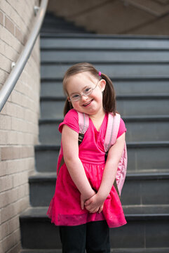 Exuberant Little Girl with Down Syndrome Smiling In School