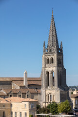 Fototapeta na wymiar Bell tower of Monolithic Church in Saint Emilion. France. St Emilion is French village famous for the excellent red wine.
