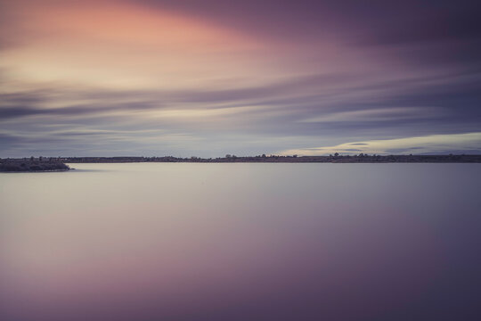 Landscaoe with sunset on a big lcalm ake on winter, Lleida, Spain.