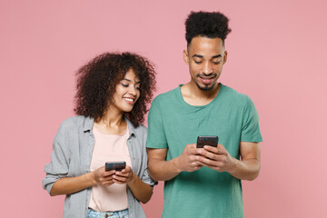 Smiling young african american couple two friends guy girl in gray green casual clothes posing...