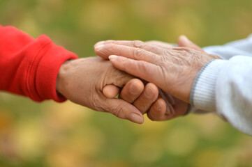 Hands of senior Couple, cropped background close-up 