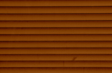 Background of the brown plastic siding. Plastic siding surface in brown tone. Abstract background and texture.