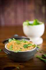 boiled bulgur groats with vegetables and herbs